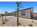 Private backyard with stone landscaping, providing the perfect space for relaxation and outdoor entertaining at 10158 Super Jovian St, Las Vegas, NV 89143
