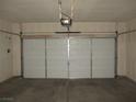 Spacious two car garage with a working garage door opener at 11039 Pegasus Dr, Las Vegas, NV 89135