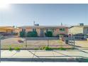 Modest single-story home with gravel front yard and chain link fence at 1805 Helen Ave, North Las Vegas, NV 89032