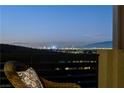 Balcony view showcasing the city skyline with lights twinkling against the dark sky at 1968 Regal Bluff Dr, Henderson, NV 89052