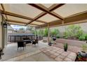 Inviting backyard featuring a covered patio, an above-ground pool, and lush landscaping at 2613 Country Mile Dr, Las Vegas, NV 89135