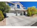 Inviting home exterior boasting a three-car garage and a beautifully landscaped front yard at 2726 Manteno Ct, Henderson, NV 89052