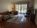 Inviting living room featuring a fireplace, and sliding glass doors for natural light at 2796 Cape Hope Way, Las Vegas, NV 89121