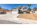 Two story home with desert landscaping and large driveway at 4121 Satinwood Dr, Las Vegas, NV 89147