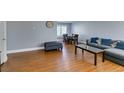 Open living room featuring dining area and hardwood floors at 4121 Satinwood Dr, Las Vegas, NV 89147
