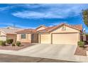 Beautiful one-story home with a stucco exterior, tile roof, and a spacious two-car garage at 6217 Statue St, North Las Vegas, NV 89081