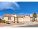 Charming single-story home featuring a well-maintained front yard and a spacious two-car garage at 6217 Statue St, North Las Vegas, NV 89081