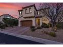 Charming two-story home with a well-maintained lawn, brick driveway, and a welcoming front entrance at 640 Hayborn Meadows St, Las Vegas, NV 89138