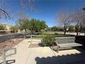 A well maintained neighborhood park with seating and green space at 6546 Churnet Valley Ave, Las Vegas, NV 89139