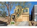Charming two-story home featuring a well-kept yard and attached single car garage at 7506 Village Mist Ln, Las Vegas, NV 89113