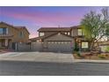Beautiful two-story home featuring a three car garage and low-maintenance desert landscaping at 1109 Pincay Dr, Henderson, NV 89015