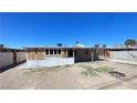 Spacious backyard area with a fire pit. and ample space for outdoor activities at 1308 Harriet St, Las Vegas, NV 89101