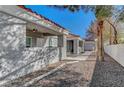 Close-up of stucco home with red tile roof and covered porch at 1840 N Jones Blvd, Las Vegas, NV 89108