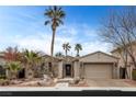 Charming single-story home featuring a stone facade, well-manicured landscaping, and an attached two-car garage at 2822 Soft Horizon Way, Las Vegas, NV 89135