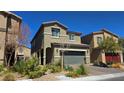Charming two-story home with a well-kept yard, desert landscaping, and a two-car garage at 3820 Ramura Ave, North Las Vegas, NV 89084