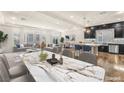 Elegant open-concept living room and kitchen with marble dining table and modern decor at 5671 Camilla Cellars Ct, Las Vegas, NV 89141