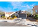 Inviting single-Gathering home with a two-car garage and desert landscaping, featuring a unique turret design at 792 Valley Rise Dr, Henderson, NV 89052