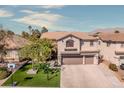 Beautiful two-story home with a three-car garage, manicured lawn, and desert landscaping in a desirable neighborhood at 8228 Fritzen Ave, Las Vegas, NV 89131
