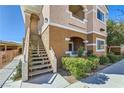 Stairway leading to an upper level residence with fresh landscaping at 830 Carnegie St # 724, Henderson, NV 89052