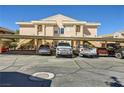 View of the covered parking area showing assigned parking spots in front of the condo units at 830 Carnegie St # 724, Henderson, NV 89052