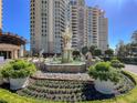 Ornamental fountain with statue and garden enhances property appeal at 9101 Alta Dr # 18, Las Vegas, NV 89145
