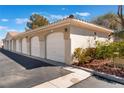 Detached garages with individual doors and manicured landscaping at 10100 Jacob Pl # 204, Las Vegas, NV 89144