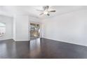 Bright living room featuring modern hardwood floors and sliding glass doors leading to balcony at 10100 Jacob Pl # 204, Las Vegas, NV 89144