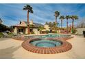 Resort style backyard with beautiful pool, tanning chairs and mature palm trees at 167 Ebb Tide Cir, Las Vegas, NV 89123