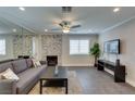 Comfortable living space features a stylish fireplace, a ceiling fan, and ample room at 1701 E Katie Ave # 51, Las Vegas, NV 89119