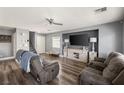 Spacious living room with wood floors, a ceiling fan, and comfortable seating at 232 Dog Leg Dr, Las Vegas, NV 89148
