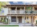 Inviting townhome featuring a charming balcony, covered entrance, and well-maintained landscaping at 3189 Pinehurst Dr # B, Las Vegas, NV 89109