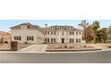 An elegant two-story home with a three car garage, a manicured front yard, and a classic design at 3207 Bel Air Dr, Las Vegas, NV 89109