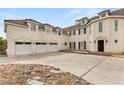 Elegant multi-story home with a three-car garage, a stucco exterior, and a well-manicured front yard at 3207 Bel Air Dr, Las Vegas, NV 89109