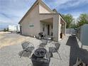 Backyard patio featuring an outdoor seating area with a fire pit and BBQ at 4830 E Comanche Dr, Pahrump, NV 89061
