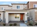 Charming townhome with a covered entryway, complemented by meticulously arranged rock landscaping at 6144 Rathbone St, Las Vegas, NV 89166