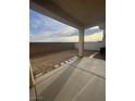Private backyard area with low-maintenance gravel landscaping and a covered patio, ideal for outdoor relaxation and entertainment at 6461 Za Zu Pitts Ave # 102, Las Vegas, NV 89122