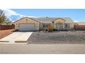 Inviting single story home featuring a two car garage and low maintenance landscaping at 6751 Stubblefield Dr, Pahrump, NV 89061