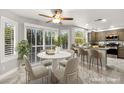 Eat-in kitchen with granite counters, modern appliances, large windows, and backyard views at 8528 Sierra Cima Ln, Las Vegas, NV 89128