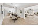 Bright, open-concept living space with modern furniture and an eat-in kitchen area at , Las Vegas, NV 89134