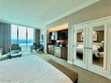 Open concept bedroom featuring a kitchenette, sitting area, and an amazing window view at 135 E Harmon Ave # 2916, Las Vegas, NV 89109