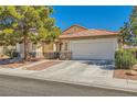 Charming single story home featuring desert landscaping and a two car garage at 1708 Gentle Brook Ave, Las Vegas, NV 89084