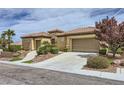 Beautiful desert home featuring mature landscaping, tile roofing and a two car garage at 2116 Burtonsville Dr, Henderson, NV 89044