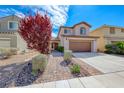 Charming two-story home featuring desert landscaping with brick walkway and mature landscaping at 2853 Blythswood Sq, Henderson, NV 89044