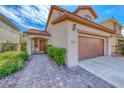 Inviting two-story home featuring a well-maintained yard, two-car garage, and beautiful landscaping at 2853 Blythswood Sq, Henderson, NV 89044