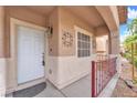 Inviting covered front porch with decorative accents, creating a warm and welcoming entrance to the home at 309 Gemstone Hill Ave, North Las Vegas, NV 89031