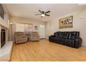 Comfortable living room with wood floors, fireplace, and neutral color palette at 3360 Cheltenham St, Las Vegas, NV 89129
