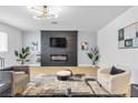Cozy living room with a modern fireplace, sleek furniture, and ample natural light at 3611 Valencia St, Las Vegas, NV 89121