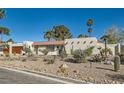 Charming single-story home featuring a terra cotta roof, desert landscaping, and an attached two-car garage at 3788 Forestcrest Dr, Las Vegas, NV 89121