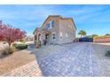 Charming two-story home with desert landscaping, gated driveway and tiled roof at 3809 Vincelli Ave, North Las Vegas, NV 89031