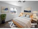 Cozy staged main bedroom featuring warm tones, stylish decor, and soft natural light at 3829 Soda Springs Dr, Las Vegas, NV 89115
